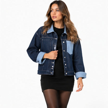 Denim jacket styled with black skirt and knee high boots