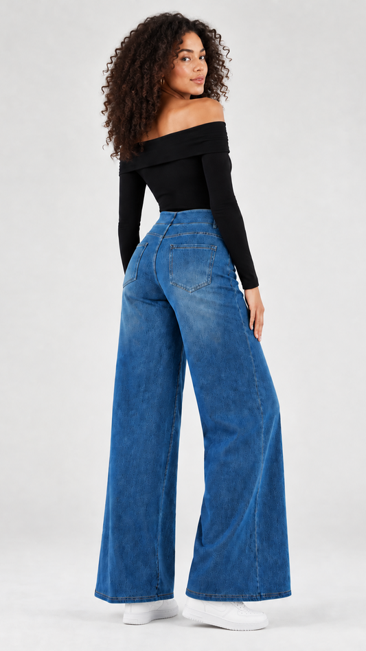 Model wearing the jeans with white trainers